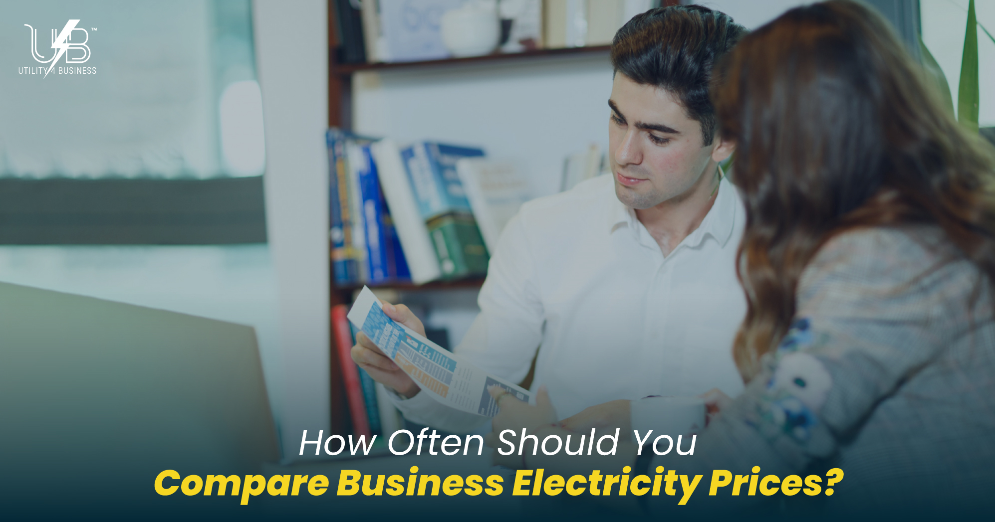 Compare business electricity prices for UK companies; two people reviewing energy bills to find the best business electricity rates and savings.